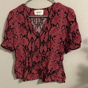 It’s a ba&sh small pink and black blouse